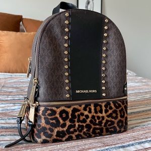 Medium sized michael kors back packs.